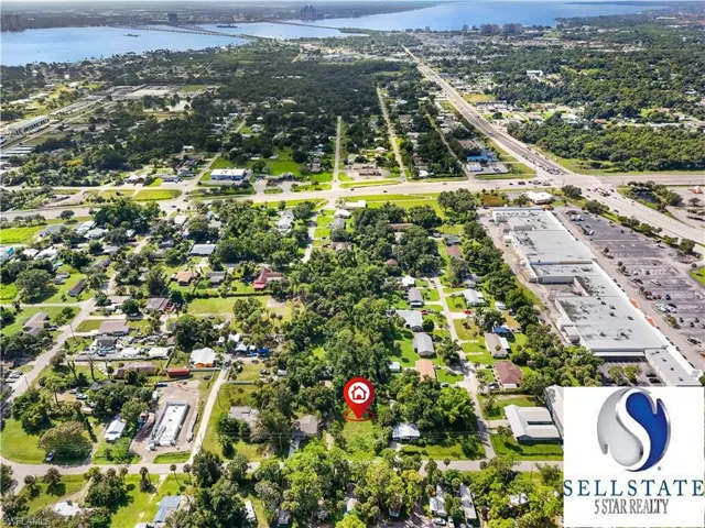 Drone / aerial view of a nearby body of water and a notable bridge