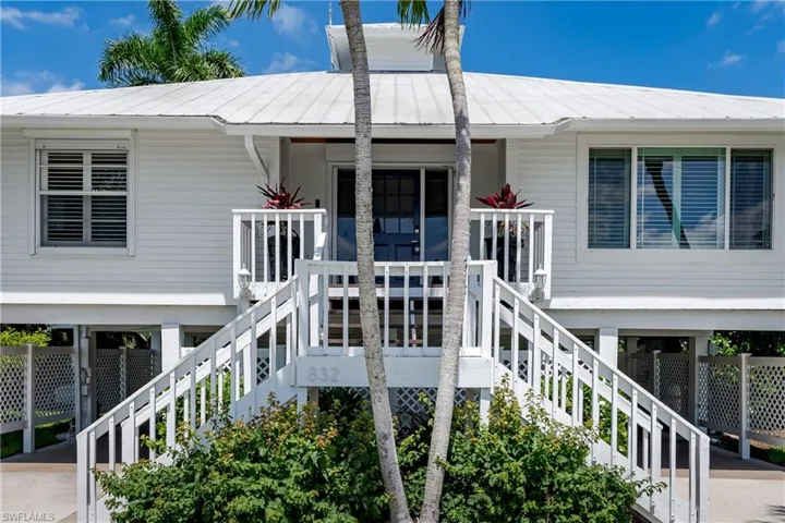 Double stairway leads to covered front porch