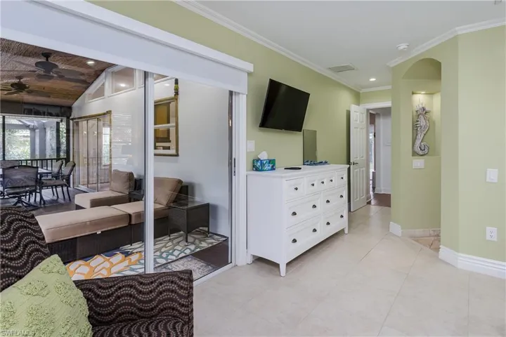 Large sliding door leads to main lanai from main bedroom