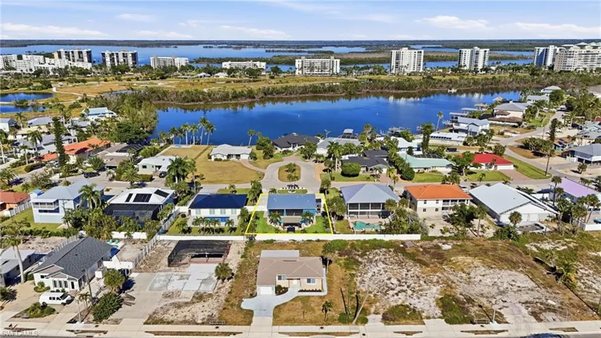 Aerial view of residential area featuring Lagoon - Virtually Edited Image