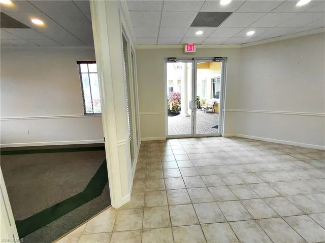 Reception area and entry to room 1 in front of office