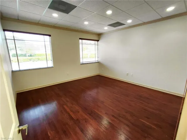 Room 3 with hardwood / wood-style flooring, a drop ceiling, and recessed lighting