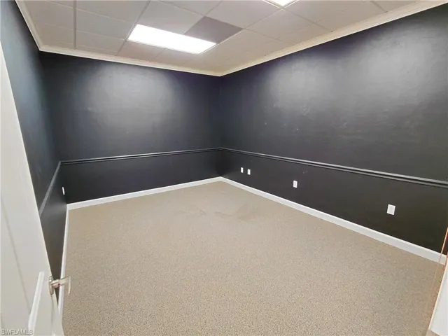 Room 5 Carpeted room featuring a paneled ceiling and healthy amount of natural light