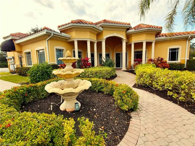 Back of property featuring stucco siding