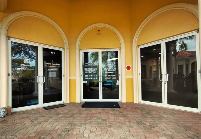 Entrance to property featuring french doors and stucco siding