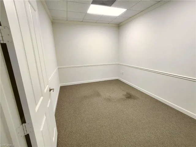 Room 6 featuring a paneled ceiling, carpet flooring, and ornamental molding
