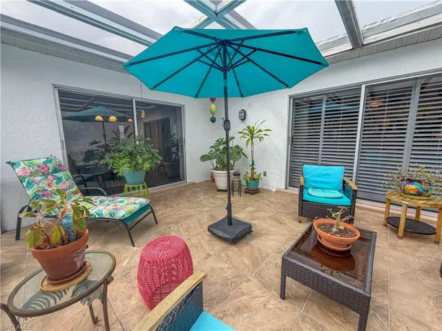 View of patio featuring a lanai and outdoor lounge area