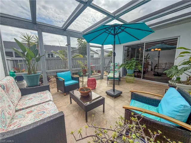 Sunroom / solarium featuring outdoor lounge area and a patio area