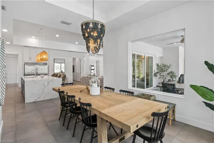 Dining space, tile flooring and custom light fixture.