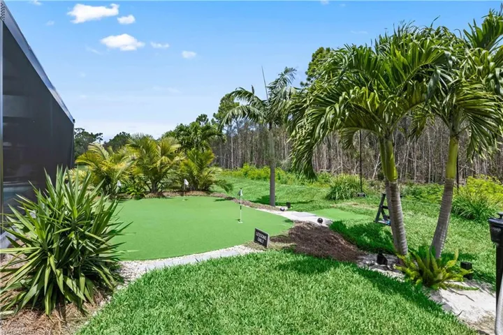 Backyard features a mini golf putting green.