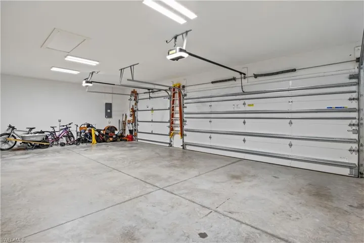 Garage featuring a garage door opener