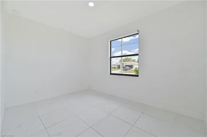 Unfurnished room featuring baseboards