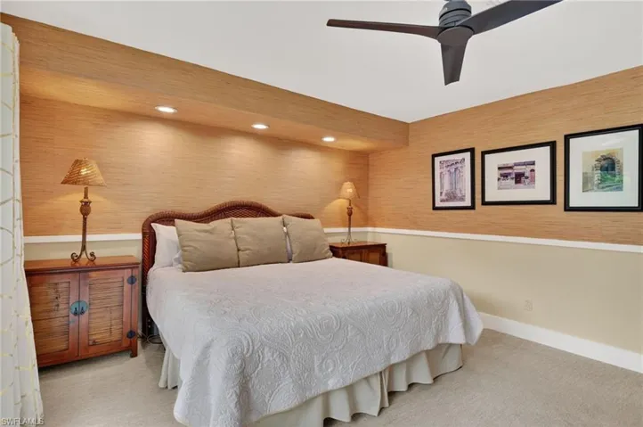 Carpeted bedroom featuring recessed lighting and ceiling fan