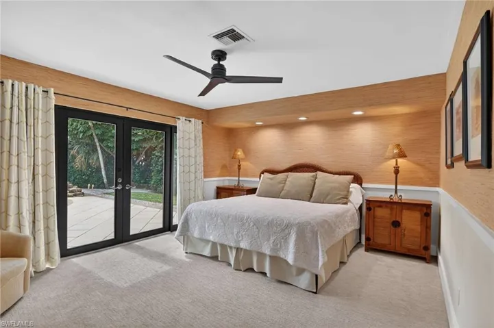 Carpeted bedroom with access to exterior, a ceiling fan, french doors, and recessed lighting