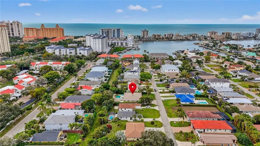 View of property location with a nearby body of water and nearby urban area