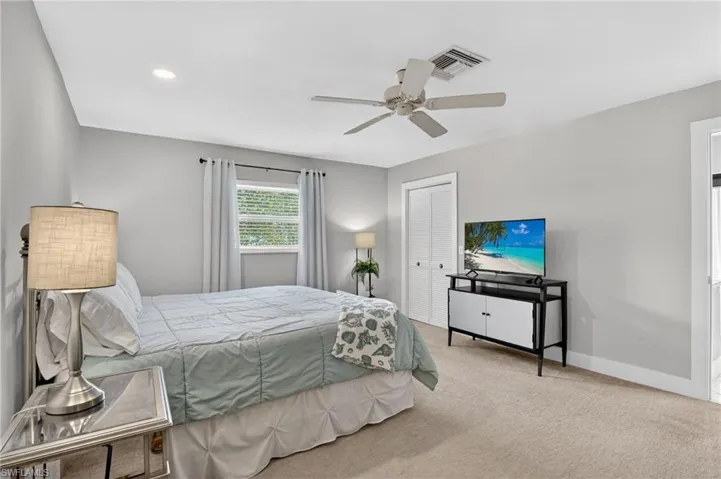 Bedroom featuring a closet, carpet floors, and ceiling fan
