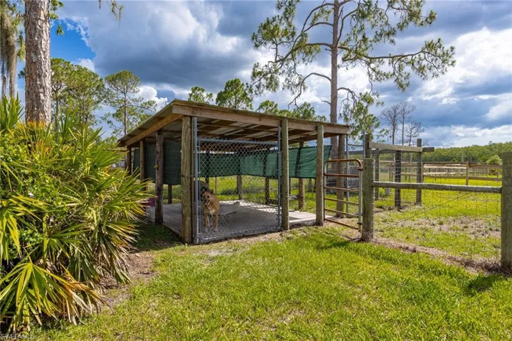 View of yard featuring an outbuilding and exterior structure