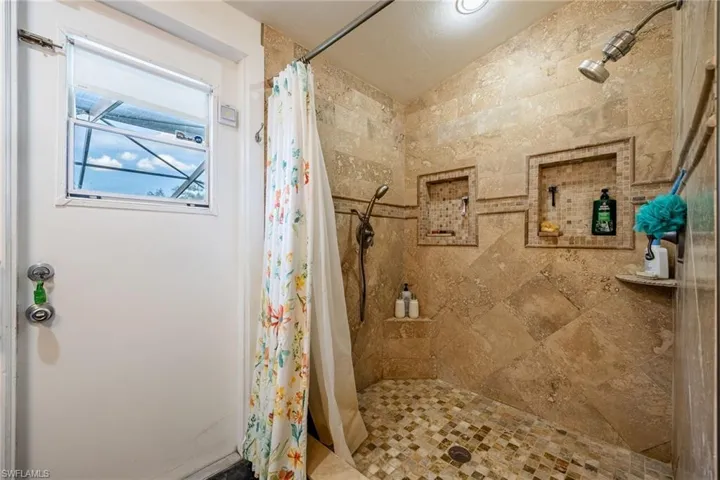 Full bathroom with a stall shower