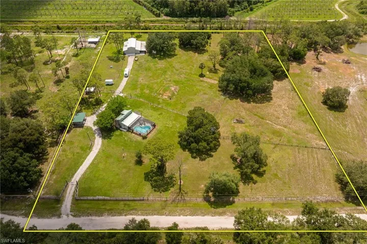 View of rural area featuring abundant farmland and property parcel outlined