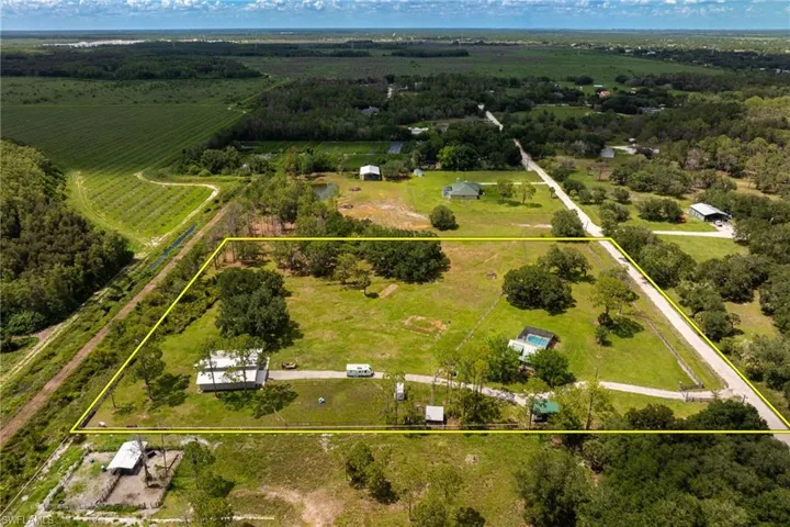 Overview of rural landscape featuring property parcel outlined and extensive farmland