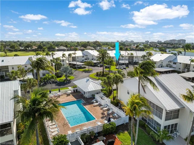 The community pool is steps away from this condo.