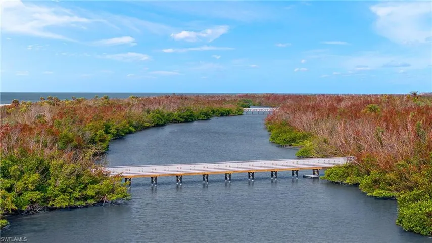 Bird's eye view of a large body of water and a notable bridge