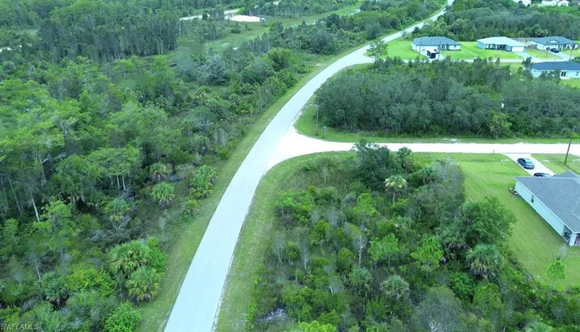 Aerial overview of property's location with a forest