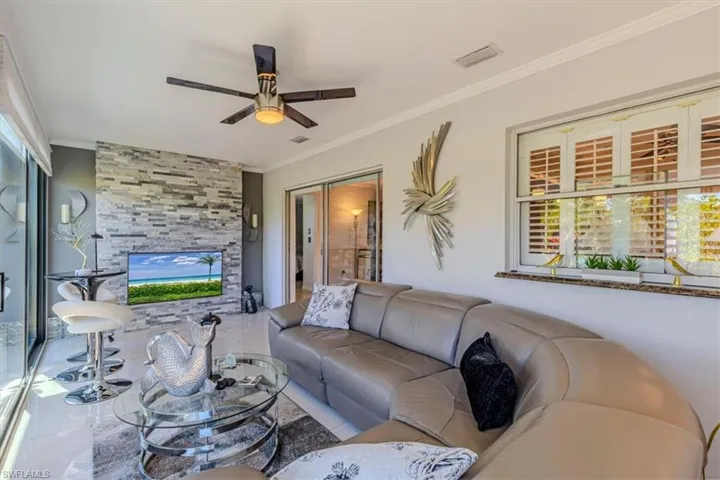 Sun room with impact glass door walls