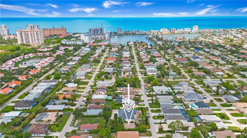 Aerial overview of property's location featuring a nearby body of water