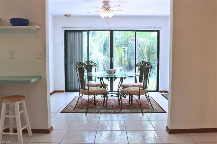 Dining space with healthy amount of natural light and ceiling fan