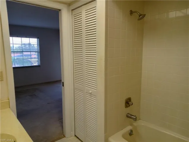 MASTER Bathroom with tiled shower / bath and vanity