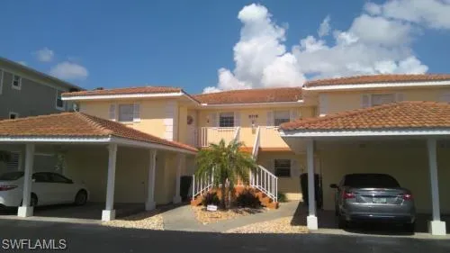 View of front of property featuring a carport