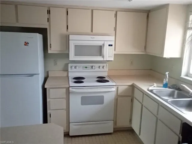 Kitchen with white cabinetry