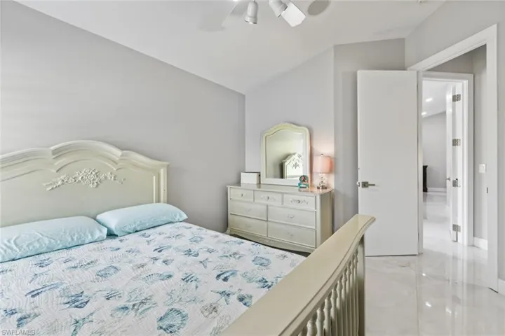 Bedroom with a ceiling fan and lofted ceiling