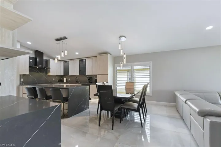 Dining space with baseboards and recessed lighting