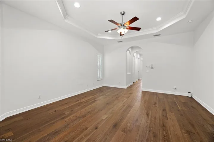 Master hall leads to walk-in closets, en-suite bath