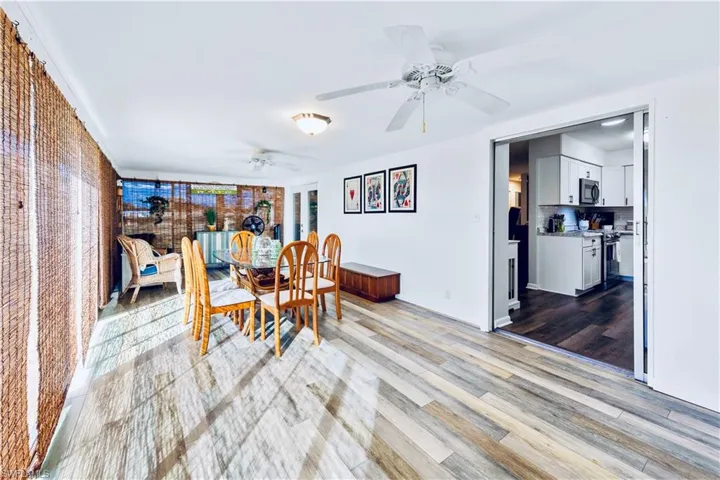 Dining room with light wood-type flooring and ceiling fan