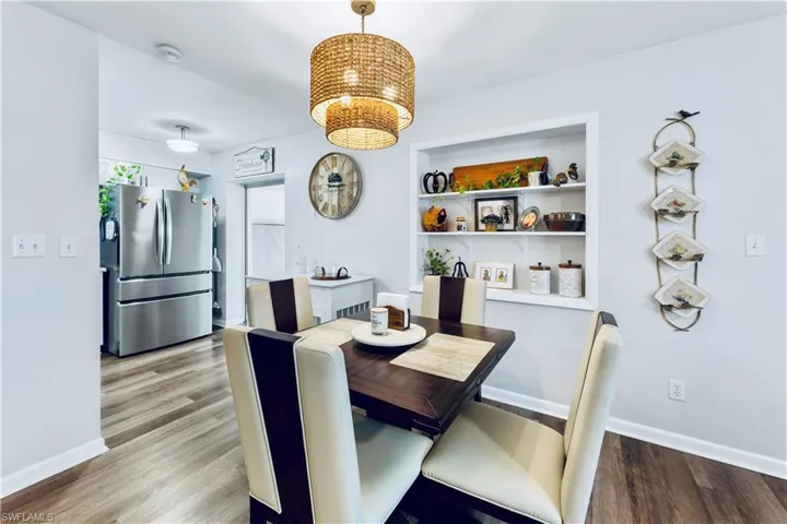 Dining area with hardwood / wood-style floors
