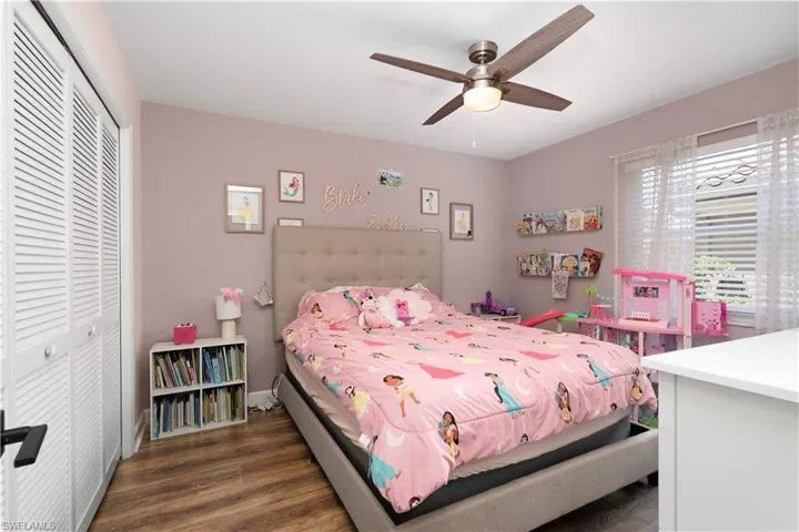 Good size split guest bedrooms have new blinds and vinyl flooring. Ample closet space.