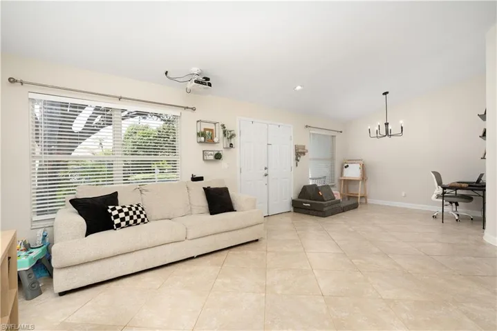 On one side is the Media Room and on the other side is the Den/Study space.  See Epson Movie Projector on ceiling which projects movies/TV shows onto the blank wall. The whole family loves it!