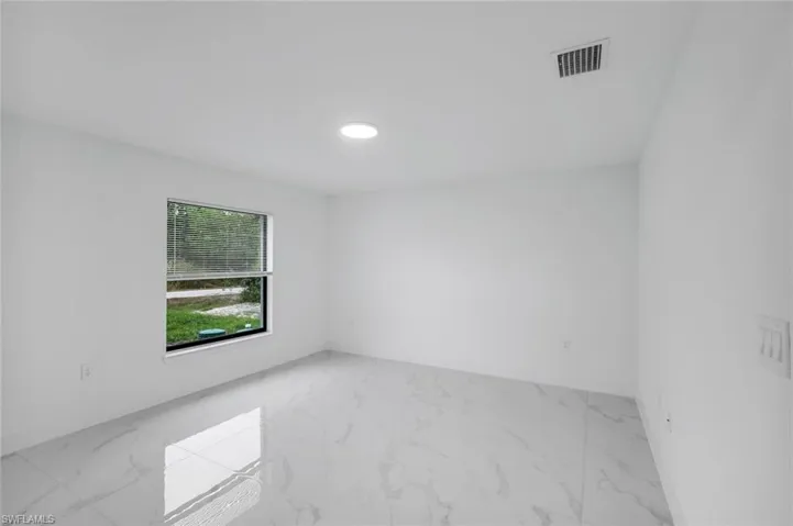Bedroom 3 room featuring marble finish flooring