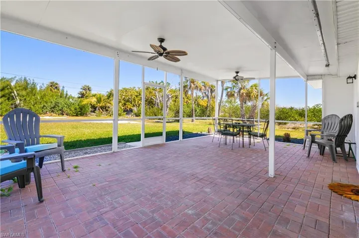 Sunroom / solarium with a ceiling fan