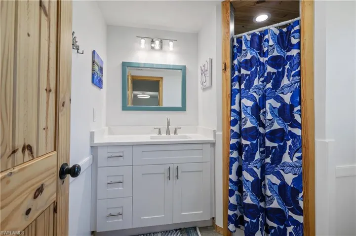 Full bathroom with vanity