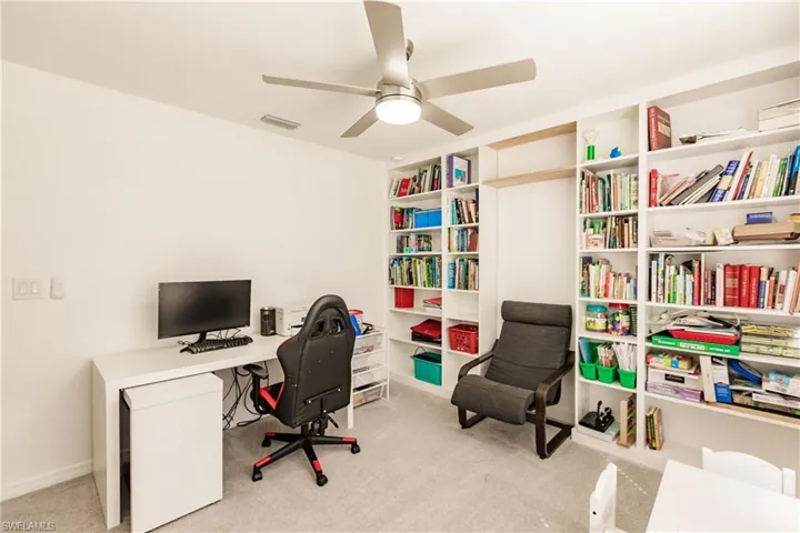 Office featuring ceiling fan and light colored carpet