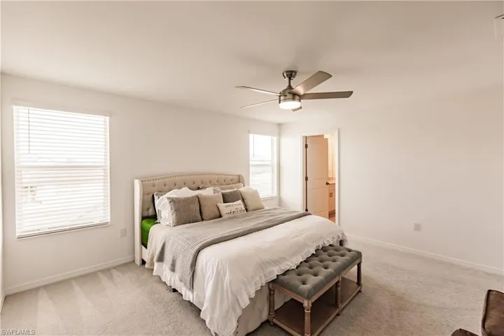 Bedroom featuring carpet flooring and ceiling fan