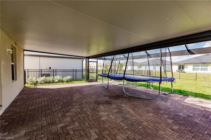 View of patio with a trampoline