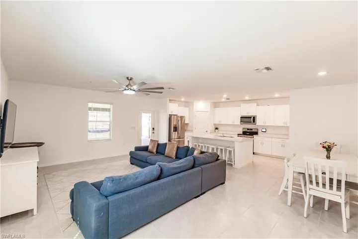 Living room featuring ceiling fan