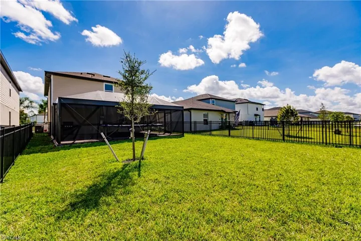 View of yard with glass enclosure