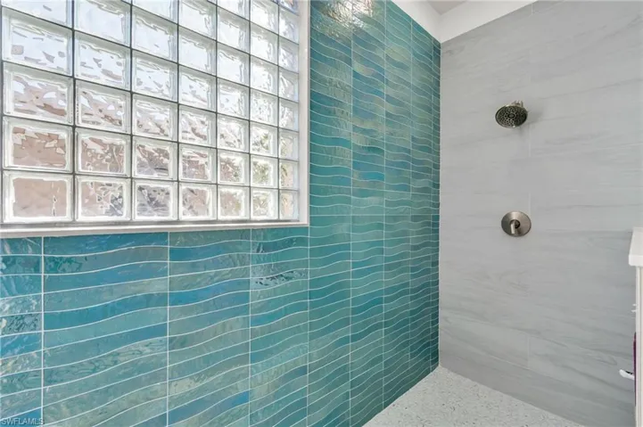 Full bath with tiled shower