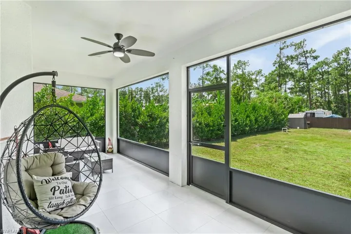 Sunroom / solarium featuring ceiling fan